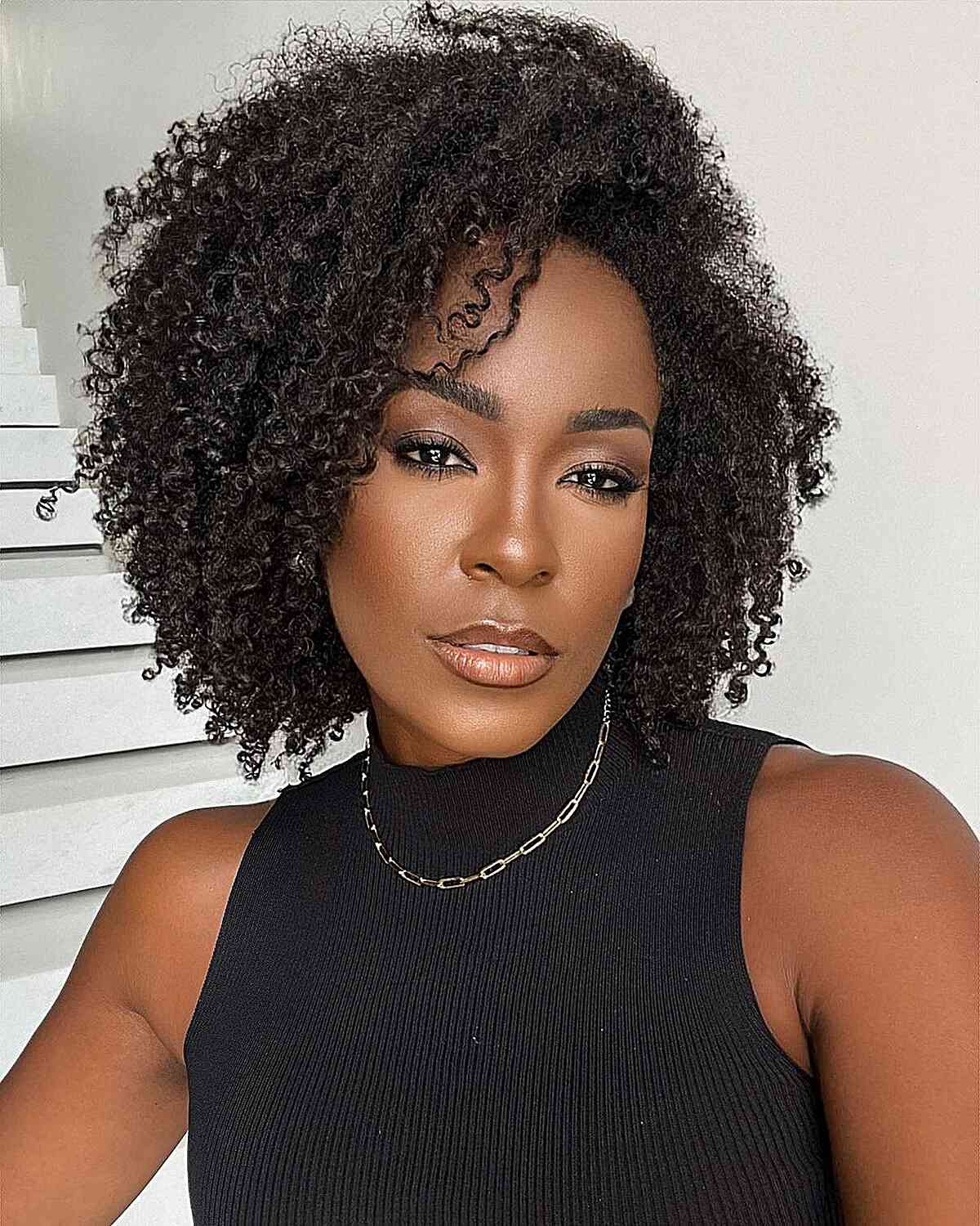 Natural Curls with a Side Part for black women with a long face