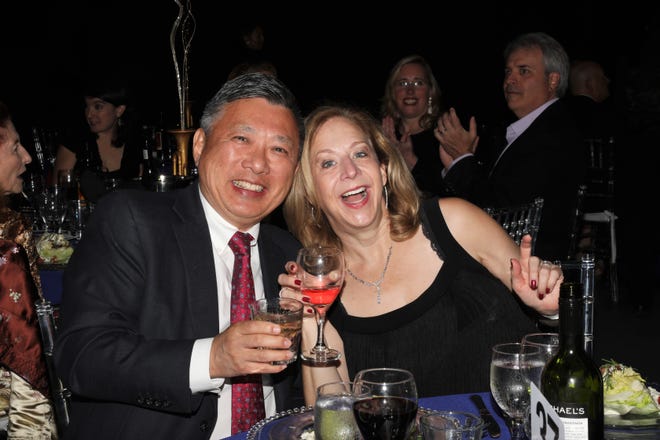 Horace and Lorrie Liang toasting at the dinner table. The Westcoast Black Theatre Troupe’s 22nd Anniversary Gala was held on Saturday, December 4, 2021 at the Circus Arts Conservatory’s Sailor Circus Arena in Sarasota, Florida. The event titled “A Night at the Savoy” turned the arena into a replication of New York City’s famous Harlem public, no-discrimination ballroom, The Savoy, which was in operation from 1926 – 1958. WBTT uses funds for education, artist development and a mentoring program geared toward underserved young people.