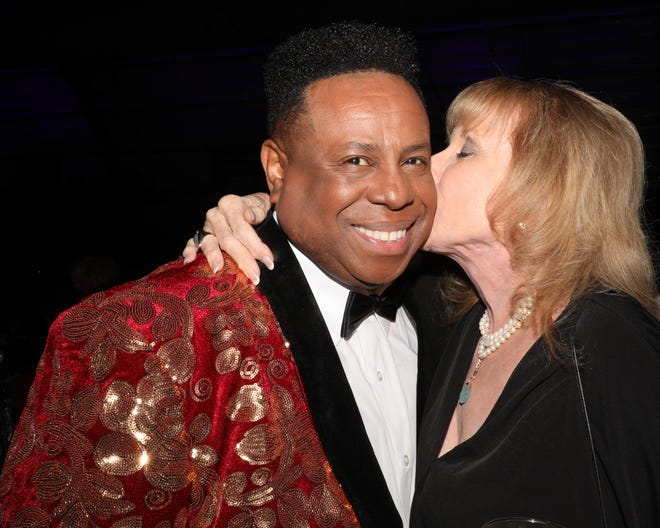 A random, candid kiss caught on camera as long-time supporter Linda Steinberger gives WBTT Founder and Artistic Director Nate Jacobs a quick appreciation peck on the cheek during the cocktail hour. The Westcoast Black Theatre Troupe’s 22nd Anniversary Gala was held on Saturday, December 4, 2021 at the Circus Arts Conservatory’s Sailor Circus Arena in Sarasota, Florida. The event titled “A Night at the Savoy” turned the arena into a replication of New York City’s famous Harlem public, no-discrimination ballroom, The Savoy, which was in operation from 1926 – 1958.WBTT uses funds for education, artist development and a mentoring program geared toward underserved young people.