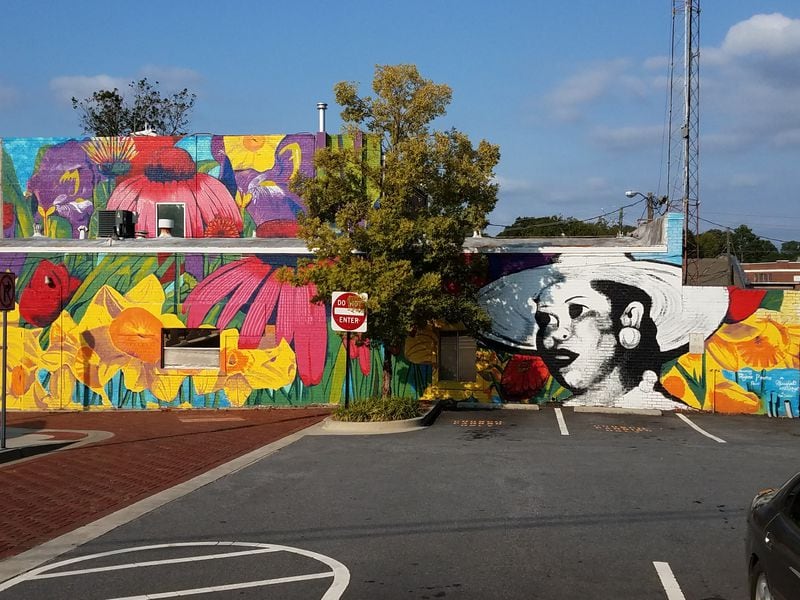 Marjorie Prothro, in a hat in Charmaine Minniefield’s mural, was Hapeville’s first Black business owner.