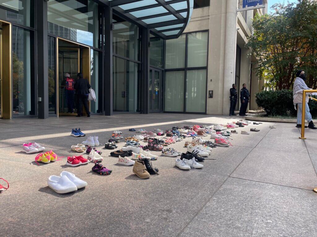 Shoes were laid out in front of the doors to represent the kids who have been killed in Palestine over the last month at Georgia State University, November 9, 2023.