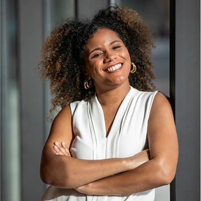 Rachel Johnson headshot woman smiling with arms crossed