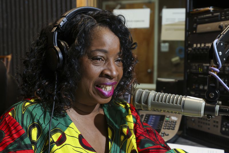WCLK Midday Jazz host Gwen Redding, aka RivaBlue, speaks on air at their station on the lower level of the Woodruff Library on Clark Atlnata’s campus, Thursday, January 25, 2024, in Atlanta. WCLK is celebrating the 50th anniversary of Atlanta's jazz station. (Jason Getz / jason.getz@ajc.com)