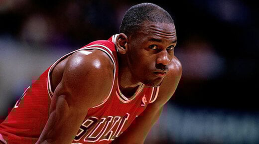 Michael Jordan #23 of the Chicago Bulls looks on durng a NBA game.