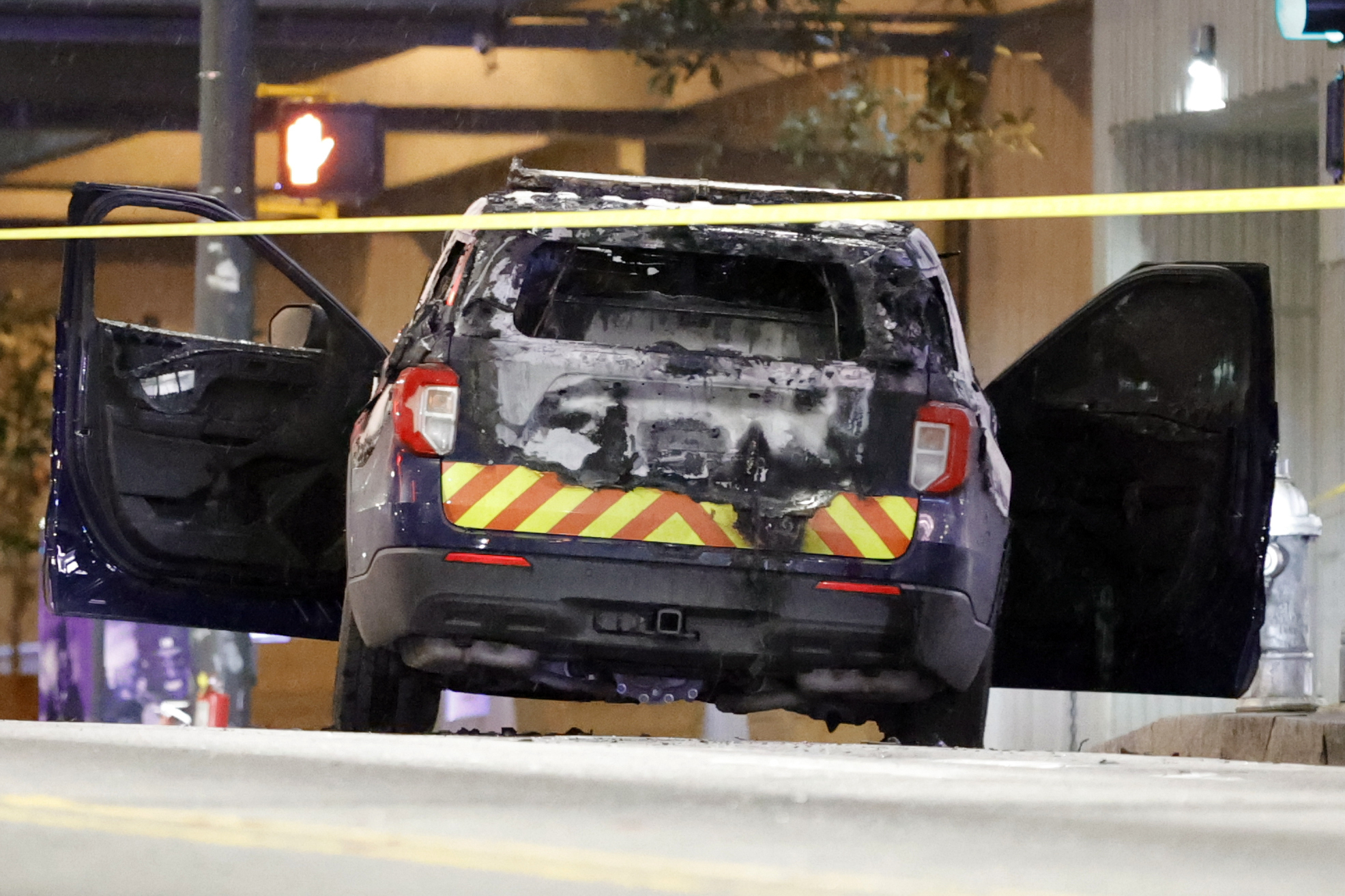 A burned police car sits on the street following a violent protest, Saturday, Jan. 21, 2023, in Atlanta A burned police car sits on the street following a violent protest, Saturday, Jan. 21, 2023, in Atlanta