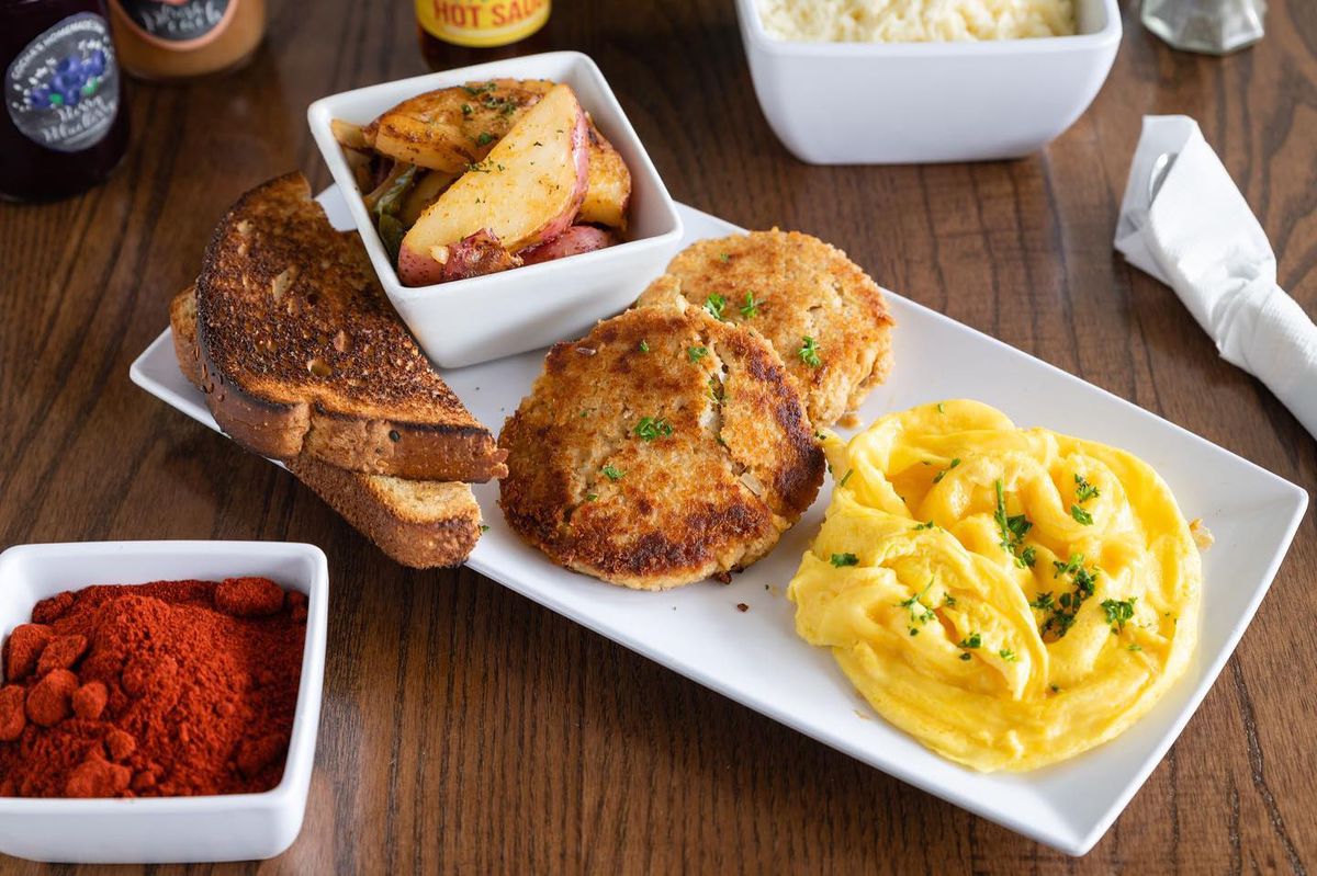 Salmon croquettes and scrambled eggs with a side of roasted herbed red potatoes and toast from Gocha’s Breakfast Bar in Atlanta. 