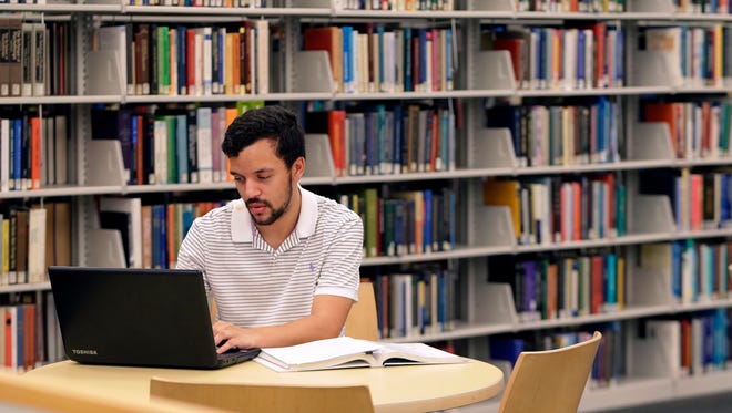 Tyler Mulvenna, who grew up outside Atlanta, studies for class in the library on the campus of Georgia State University. He started taking challenging classes in high school to prepare himself for college. Still, his odds of success weren't great. No one in his family had attended college before him, His study habits were lacking as were his financial resources. Like 60% of Georgia State students, he was eligible for federalism need-based Pell Grants. He worked hard and took advantage of everything GSU offered him through counseling, academic advising, support classes and a nurturing environment. He graduated from GSU in four years with a degree in French.