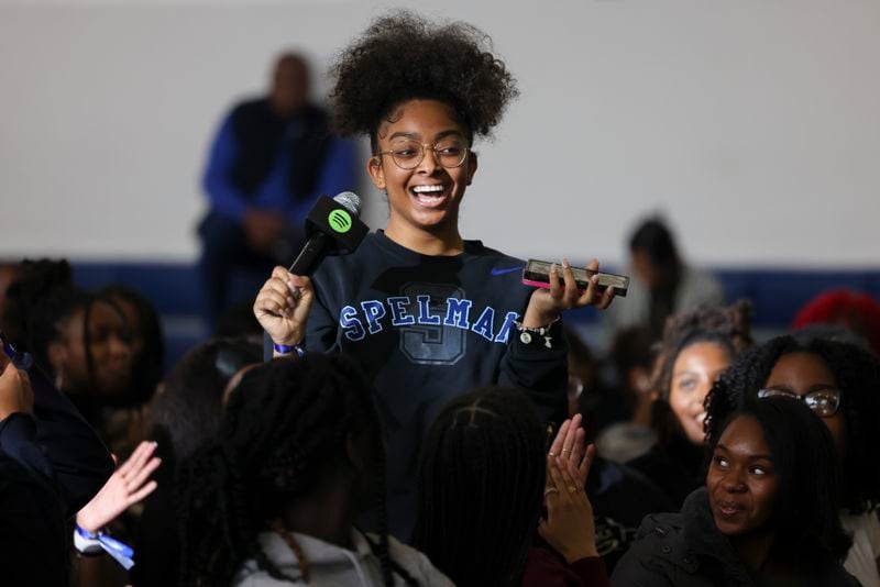 A Spelman student asks a question during Spelman Creator Day at the Wellness Center Gymnasium at Spelman College, Monday, March 20, 2023, in Atlanta. Creator Day is an audio event including influencers Rickey Thompson, Denzel Dion, and Wunmi Bello. Spelman is the first HBCU to partner with Spotify for its NextGen program. Jason Getz / Jason.Getz@ajc.com)