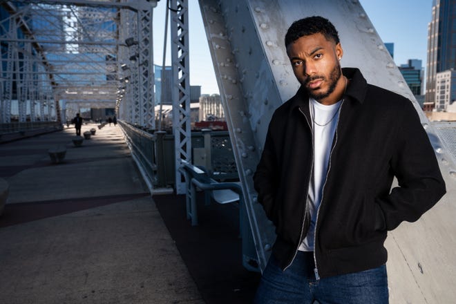 Country musician Tony Evans Jr. poses for a portrait on the John Seigenthaler Pedestrian Bridge in Nashville, Tenn., Friday, Jan. 27, 2023.