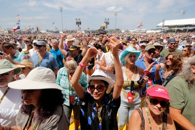 Fans cheer at the New Orleans Jazz & Heritage Festival in New Orleans, Thursday, May 2, 2019. After a two-year hiatus brought on by the coronavirus pandemic, the New Orleans Jazz & Heritage Festival returns this spring.