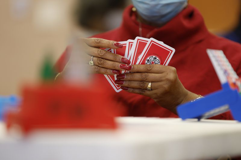 Members of the University Bridge Club meet for their weekly game at Quality Living Services in Atlanta. (Natrice Miller/natrice.miller@ajc.com) 