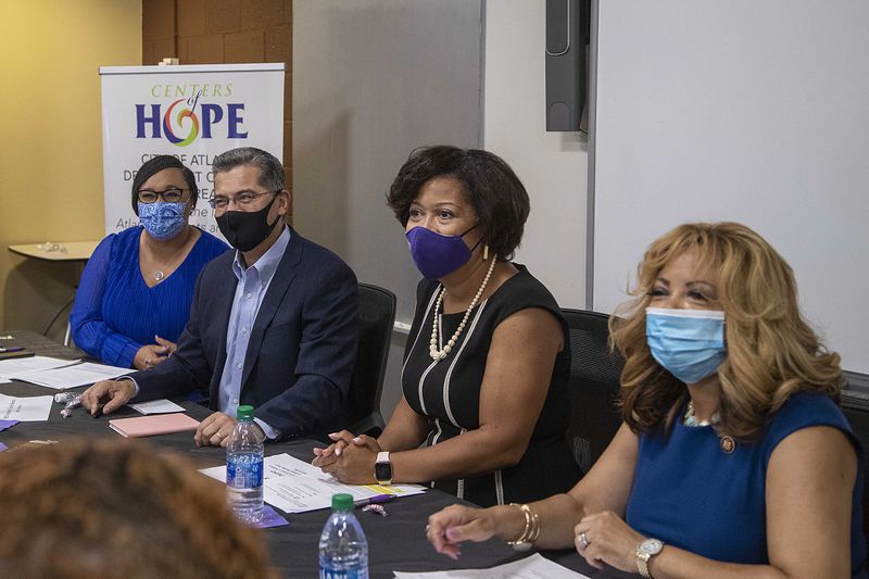 08/02/2021 —Atlanta, Georgia — U.S. Congresswoman Nikema Wiliams, from left, U.S. Department of Health and Human Services Secretary Xavier Becerra, Center for Black Women’s Wellness President and CEO Jemea Dorsey and U.S. Congresswoman Lucy McBath, right, participate in a roundtable discussion with women at The Center for Black Women’s Wellness in Atlanta’s Mechanicsville community, Monday, August 2, 2021. (Alyssa Pointer/Atlanta Journal Constitution)