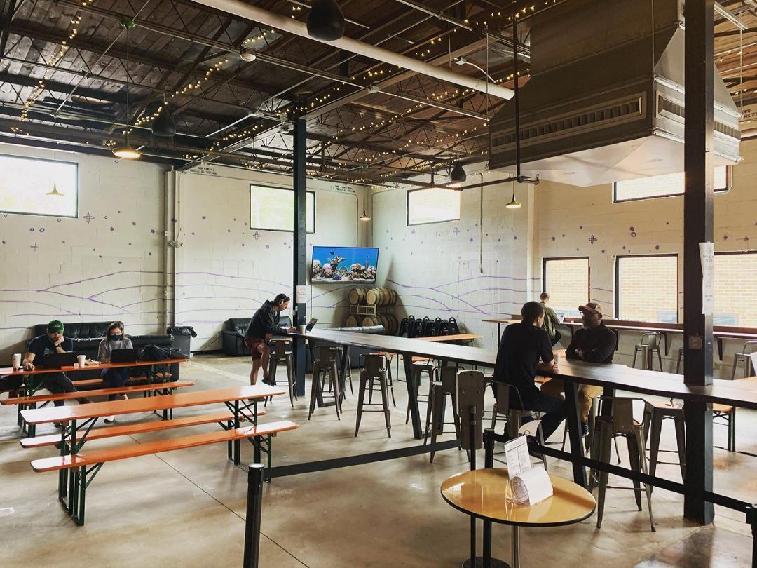 The modern, industrial-style interior at Finca To Filter.