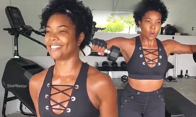Gabrielle Union shows off her taut midriff in laced-up black activewear as she works out in home gym Gabrielle Union shows off her taut midriff in laced-up black activewear as she works out in home gym