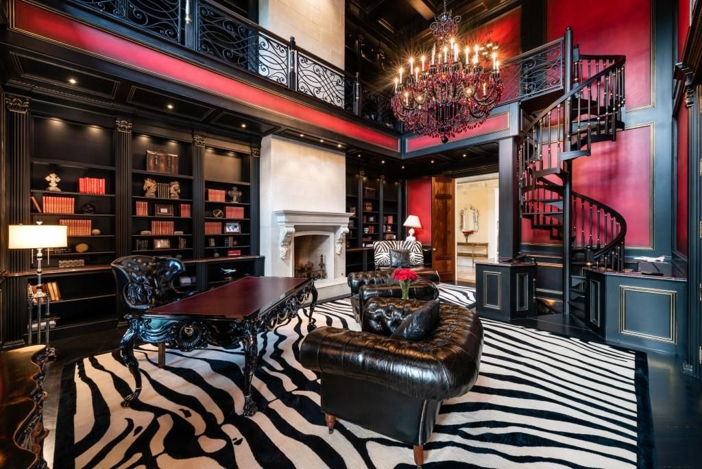  A spiral staircase leads to a colorful office space