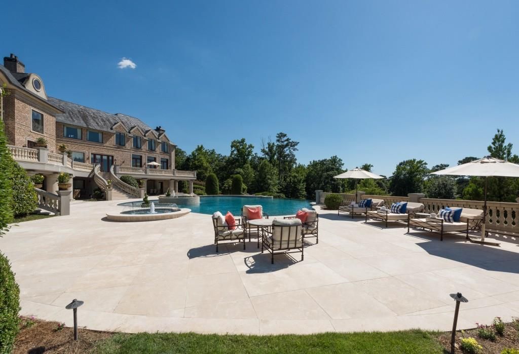  The outdoor space has a large terrace and jacuzzi that sit off the pool