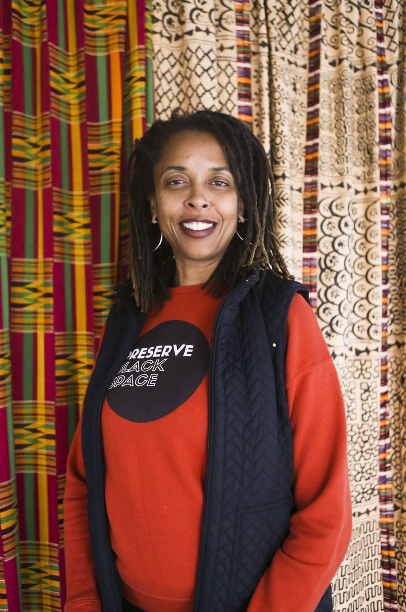 Art director Charmaine Minniefield poses for a photo on Wednesday, January 11, 2023, at Haugabrooks Art Gallery in Atlanta. Minniefield is part of the Historic District Development Corporation, which is a nonprofit that promotes community development in the Old Fourth Ward. It was created by Coretta Scott King. CHRISTINA MATACOTTA FOR THE ATLANTA JOURNAL-CONSTITUTION